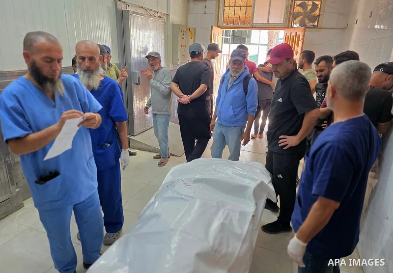 Palestinians transport the body of Abdul Jawad Jouda to Nasser Medical Complex in Khan Younis, southern Gaza Strip, on October 17, 2026. Jouda was killed in a strike targeting a group of Palestinians in the Fash Farsh ar...