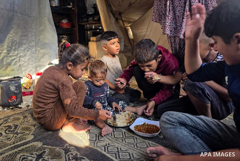 Displaced Palestinians in Khan Younis, in the southern Gaza Strip, express concerns over worsening hunger following an announcement by the World Food Programme (WFP) of cuts to its monthly food assistance, on October 19,...
