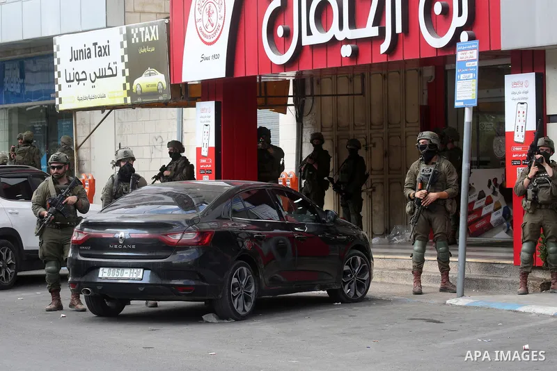 Israeli soldiers take positions during a military operation in the West Bank city of Nablus, on October 19, 2026. Several areas across the occupied West Bank have recently witnessed Israeli military raids, searches and a...