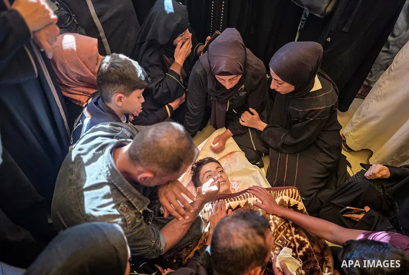 Mourners attend the funeral of two Palestinian children, Walid Shakshak and Youssef Abu Ghali, at Nasser Medical Complex in Khan Younis, in the southern Gaza Strip, on October 20, 2026. The two children were killed in an...