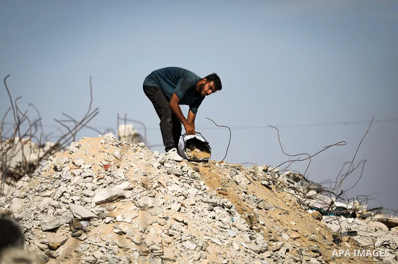 Displaced Palestinians struggle to continue their lives inside temporary tents set up near the rubble of destroyed homes in Jabalia refugee camp in the northern Gaza Strip, on October 22, 2026, amid growing fears over th...
