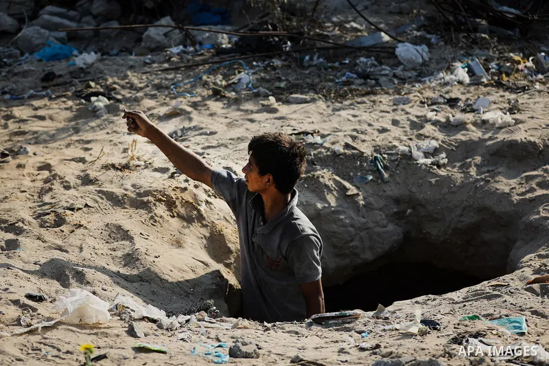 Displaced Palestinians struggle to continue their lives inside temporary tents set up near the rubble of destroyed homes in Jabalia refugee camp in the northern Gaza Strip, on October 22, 2026, amid growing fears over th...