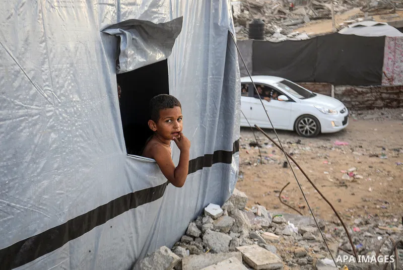 Displaced Palestinians struggle to continue their lives inside temporary tents set up near the rubble of destroyed homes in Jabalia refugee camp in the northern Gaza Strip, on October 22, 2026, amid growing fears over th...
