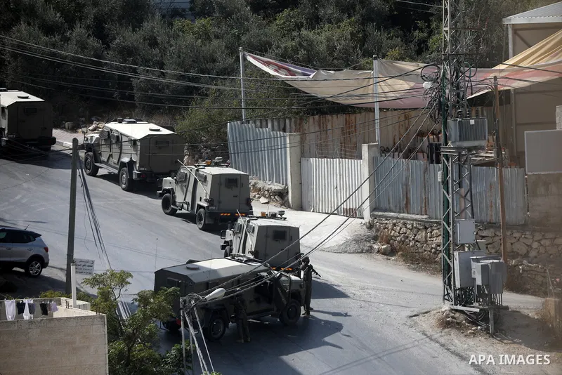 Israeli military vehicles demolish a Palestinian house near the site of a shooting incident in Hebron, in the southern occupied West Bank, on October 23, 2026. The demolition follows the killing of two Palestinians by Is...