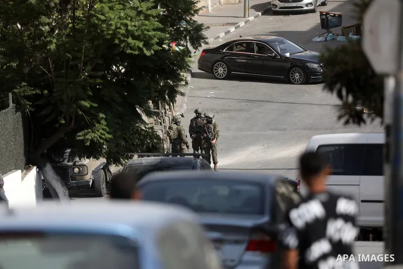 Israeli forces cordon off the area surrounding the homes of those involved in an attack the previous day and evacuate Palestinian families from their homes in the West Bank city of Hebron, on October 24, 2026. The operat...