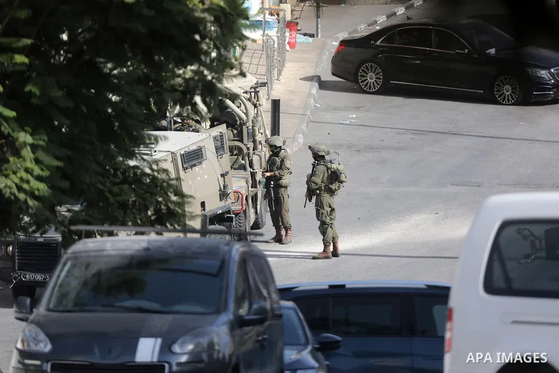 Israeli forces cordon off the area surrounding the homes of those involved in an attack the previous day and evacuate Palestinian families from their homes in the West Bank city of Hebron, on October 24, 2026. The operat...