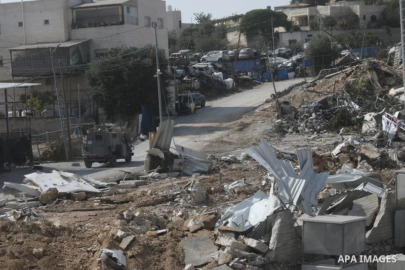 A view shows damage to Palestinian commercial properties near a checkpoint where a shooting attack took place in the West Bank city of Hebron, on October 24, 2026. The damage occurred during an Israeli military operation...