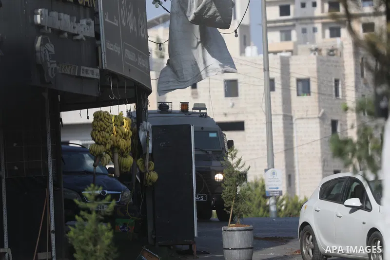 Israeli soldiers and military vehicles are deployed along streets in the West Bank city of Hebron, on October 25, 2026, as an Israeli military operation continues for the third consecutive day. The operation involves roa...