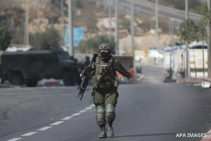 Israeli soldiers and military vehicles are deployed along streets in the West Bank city of Hebron, on October 25, 2026, as an Israeli military operation continues for the third consecutive day. The operation involves roa...