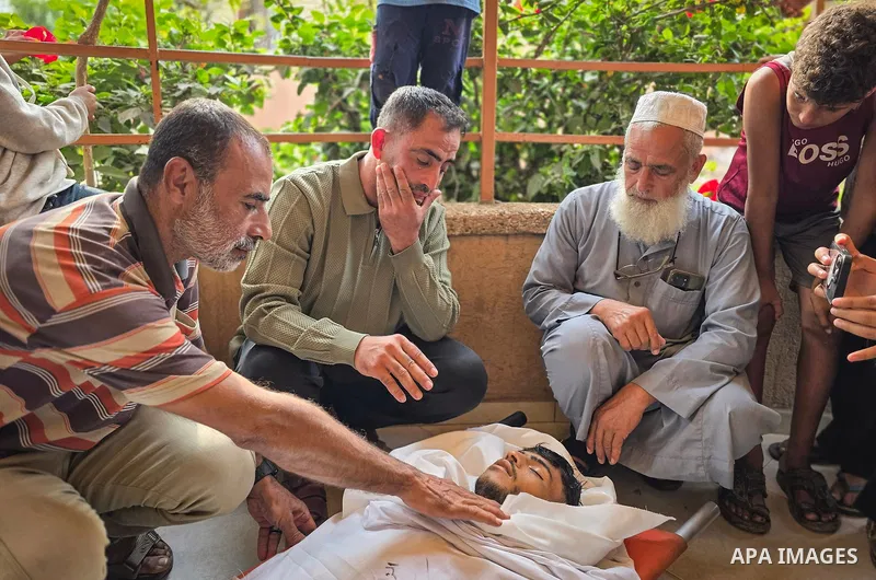 Mourners attend the funeral of Palestinians Hussam al-Zamli, child Jouri al-Soufi and Tamer Abu Sneima in Khan Younis, southern Gaza Strip, on October 26, 2026. The three were killed by Israeli forces' gunfire in the al-...