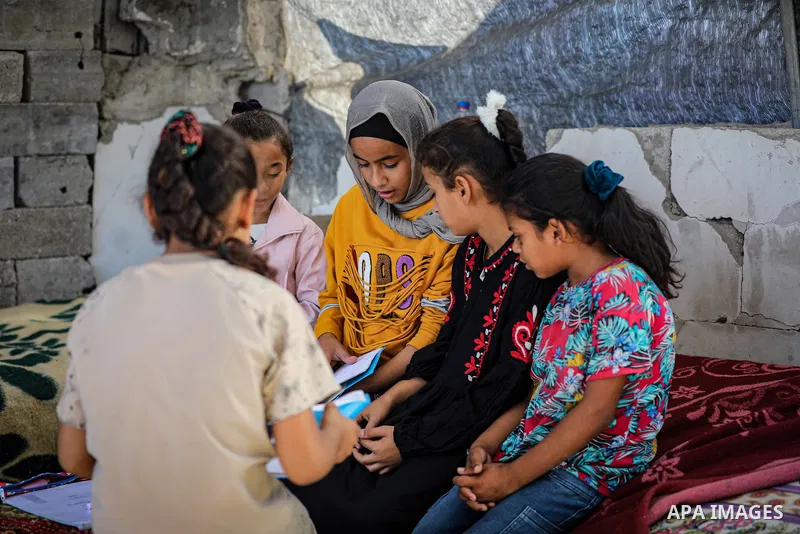 Palestinian girl Shahd Maarouf, 12, who lost one of her hands after being injured by shrapnel from Israeli shelling that struck a house next to her family's home, lives in a displacement camp in the al-Zarqa area, northe...