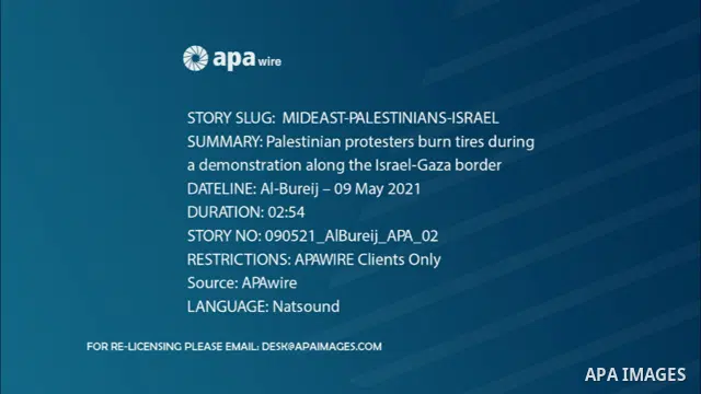 Palestinian protesters burn tires during a demonstration along the Israel-Gaza border, east Al-Bureij camp, in the center of the Gaza Strip in solidarity the Palestinians in Jerusalem's Sheikh Jarrah neighborhood, where...