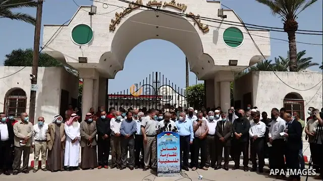 Members of the Palestinian factions take part in a protest in solidarity with Al-Aqsa Mosque, in front of the Legislative Council headquarter 01.