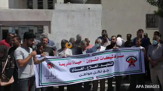Supporters of the Democratic Front for the Liberation of Palestine, take part in a protest to demand the payment of social affairs allowances, in Gaza city. 0.1