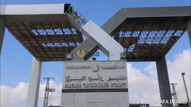 Members of Palestinan security forces stand guard at the closed down Rafah border crossing to Egypt in the southern Gaza Strip.