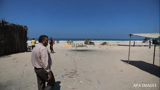 Palestinian workers build a corniche at the beach in the Mediterranean Sea in Deir al-Balah in the center of Gaza Strip. 0.1
