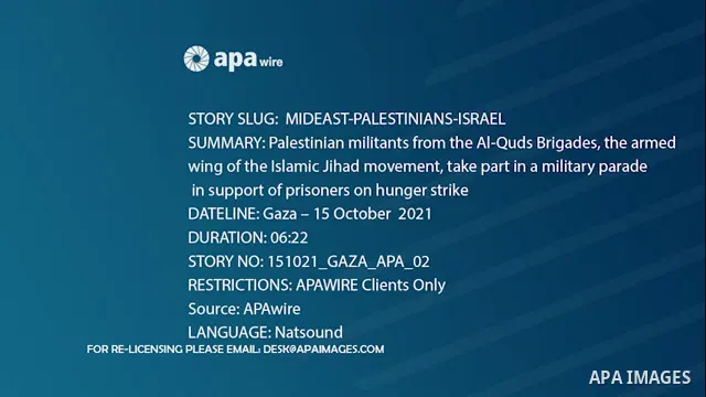 Palestinian militants from the Al-Quds Brigades, the armed wing of the Islamic Jihad movement, take part in a military parade, in support of prisoners on hunger strike held in Israeli jails. 0.1