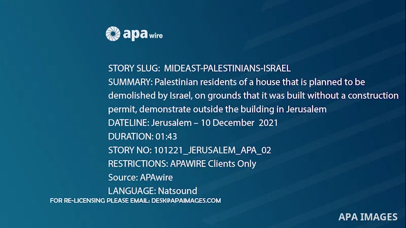 Palestinian residents of a house that is planned to be demolished by Israel, on grounds that it was built without a construction permit, demonstrate outside the building in the mostly-Arab east Jerusalem neighbourhood of...