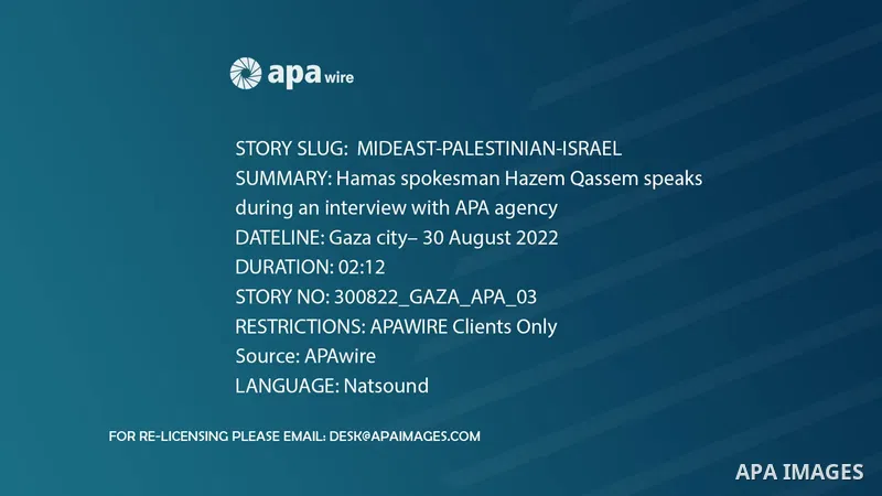 Hamas spokesman Hazem Qassem speaks during an interview with APA agency in Gaza city.