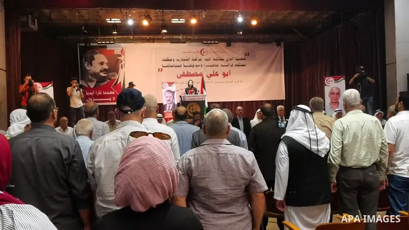 Palestinian supporters of the Popular Front for the Liberation of Palestine, attend the national festival the The 21th anniversary of the killing of Abu Ali Mustafa, leader of (PFLP), in Gaza city. 01.