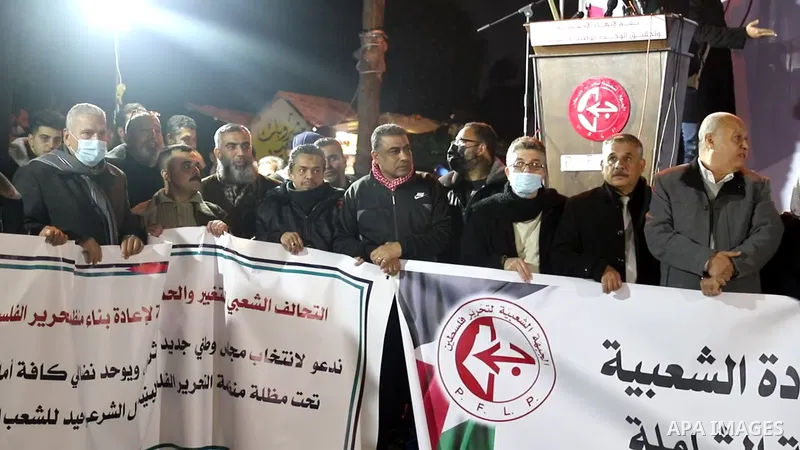 Palestinians take part in a protest against the session of Central Council.