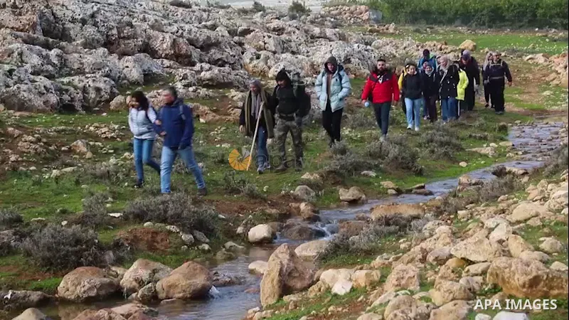 Palestinians take part in an adventure to explore a mountainous region extending from Ain Samiya in Kafr Malik village in the Northeast of Ramallah, to the village of al-Auja, near the West Bank city of Jericho.