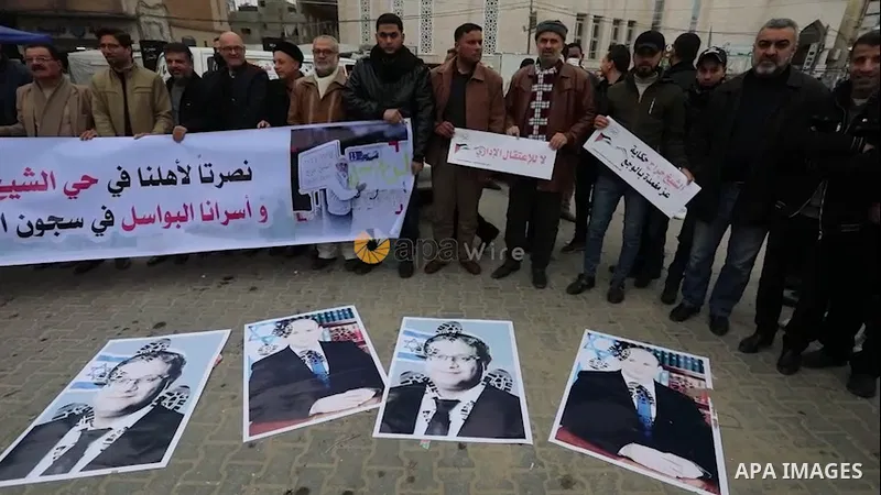 Palestinians take part in a protest in solidarity with east Jerusalem neighbourhood of Sheikh Jarrah, in Khan Younis in the southern Gaza Strip.