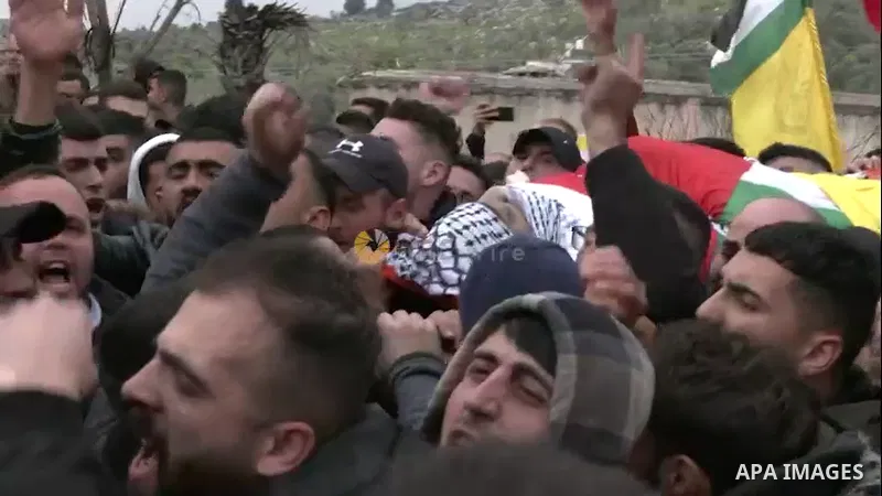 APAwire - APAwire CLIENTS ONLY, Nablus - 09 March. Palestinian mourners carry the body of Ahmad Saif, who died as a result of injuries sustained four days ago during clashes with Israeli soldiers following a demonstratio...