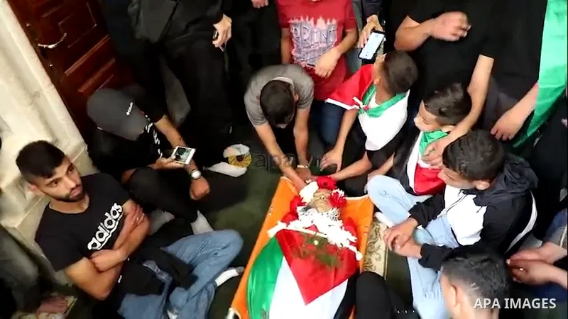 Mourners attend the funeral of Palestinian Mohammad Fadi Nuri, 16, who died from a gunshot wound sustained during clashes with Israeli forces near Ramallah last month in the West Bank city of Ramallah.