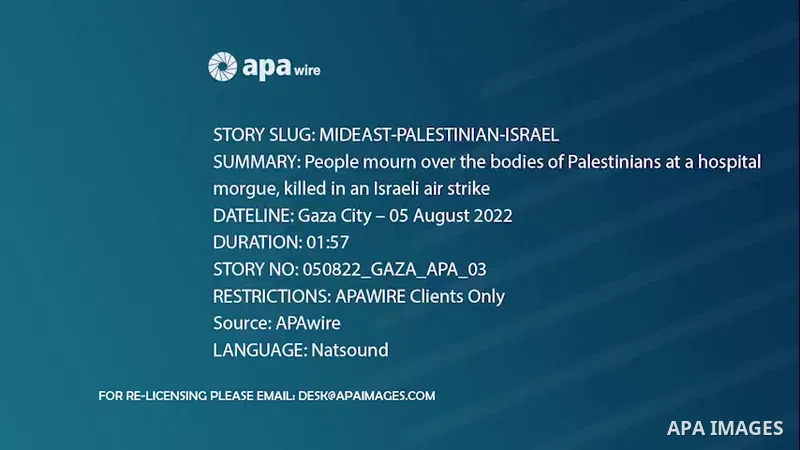 People mourn over the bodies of Palestinians at a hospital morgue, killed in an Israeli air strike in Gaza City.