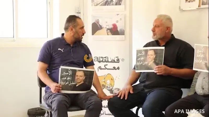 Palestinians take part in a protest demanding to release the prisoner on hunger strike Khalil Awawda, in Red Cross office, in the West Bank city of Bethlehem. 0.1