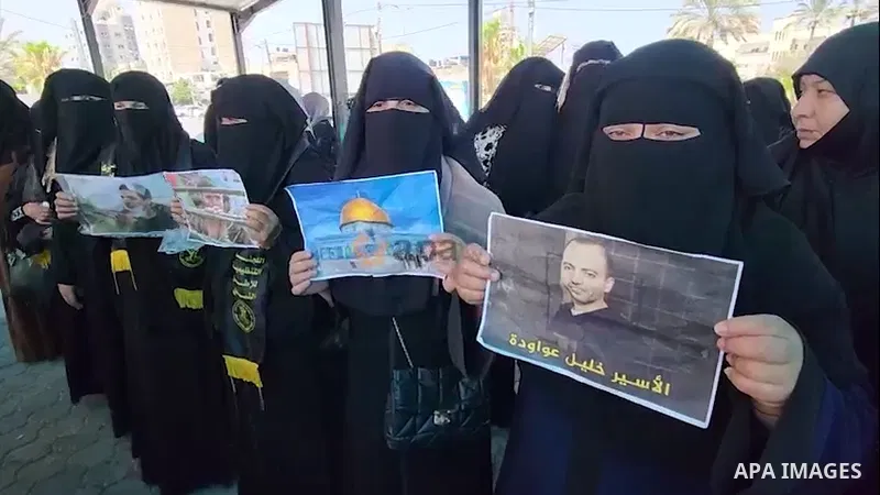 Palestinian Islamic Jihad supporters take part in a protest against arrest the Bassam al-Saadi in the Khan Younis in the southern Gaza Strip 0.1