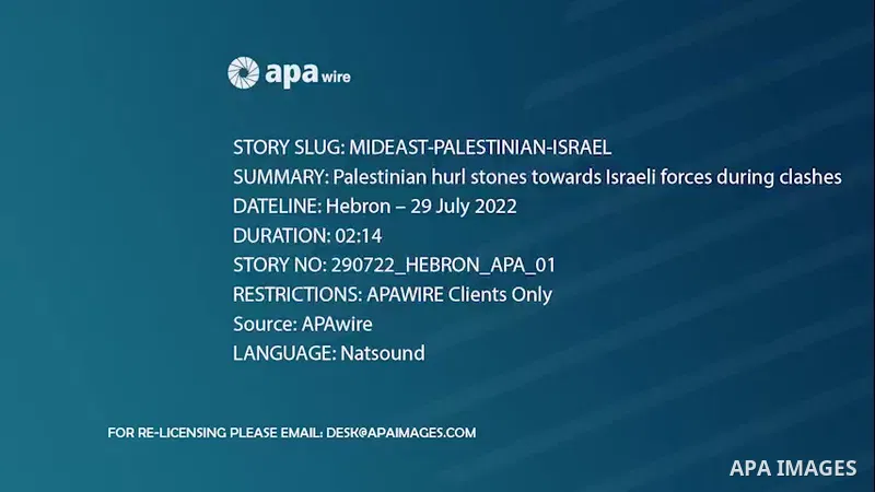 Palestinian hurl stones towards Israeli forces during clashes, in the West Bank city of Hebron. Footage by /APA