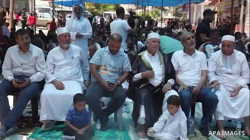 Palestinians attend Friday prayer in front of Red cross office in solidarity with prisoners on hunger strike in Israeli jails, in Gaza city. 0.1