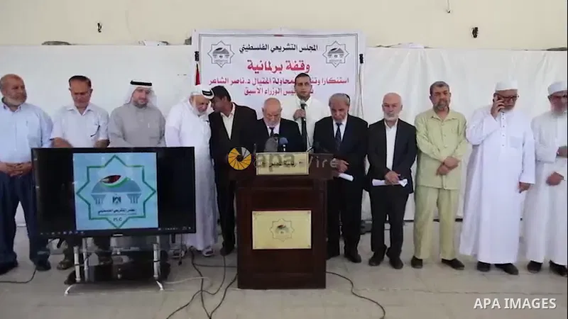 Members of the Legislative Council take part in a protest aganist shooting on former Palestinian Prime Minister Nasser Al-Din Al-Shaer on Friday in the village of Kafr Qalil, south of Nablus at the Legislative Council he...
