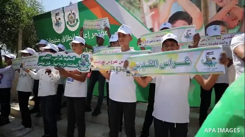 Palestinian supporters of Hamas attend the press conference to announce the launch of its summer camps "Grass_Al-Quds" in Khan Younis in the southern of Gaza strip. 0.1