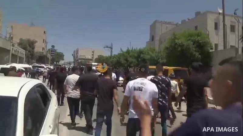 People gather during the funeral of four Palestinian death during a traffic accident, in the West Bank city of Hebron. 0.1