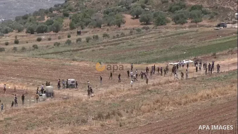 Palestinian demonstrators clash with Israeli forces during a protest against attempts by Israeli settlers from the settlement of Eli to reportedly take control of a water spring, in the village of Qaryut, south of Nablus...