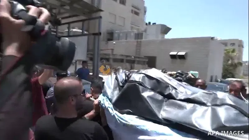 Palestinian mourners attend the funeral of Nabil Ghanem killed on June 19 by Israeli forces near a security barrier, in the West Bank city of Nablus.
