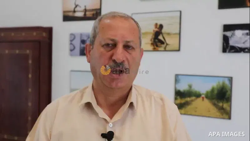 A coordinator for the Joint Refugee Committee Mahmoud Khalaf speaks during an interview with APA in Gaza city.