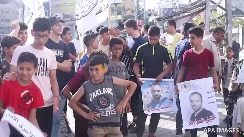Palestinian supporters of al-Ahrar movement take part in a protest in solidarity with prisoners on hunger strike at Israeli jails, in Gaza city. 0.1