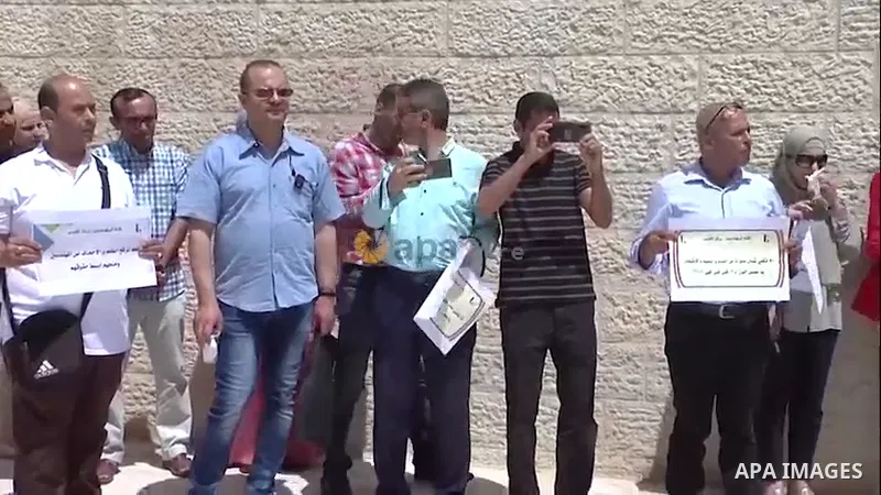Palestinian engineers participate in a protest to demand their rights in front of the engineers syndicate headquarters, in the West Bank city of Ramallah. 0.1