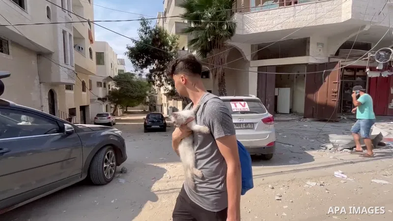 Palestinians walk through debris and destruction littering a street in al-Karama district in Gaza City. 0.1