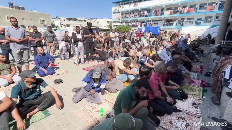 Palestinians perform Friday prayer at the school garden that is affiliated by the United Nations Relief and Works Agency for Palestine Refugees (UNRWA) in Dair El_Balah, Gaza.