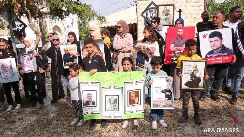 People shout slogans and wave flags as they hold a protest in support of Palestinian prisoners in Israeli occupation prisons, in the city of jenin in the occupied West Bank.