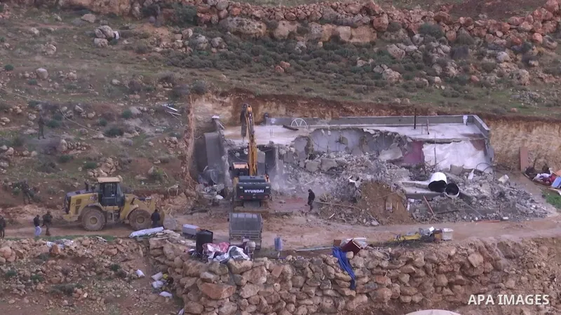 Israeli bulldozers demolish a Palestinian owned house, built without a permit from the Israeli authorities in the area C which lies under their control since 1967, in the West Bank village of Duma.