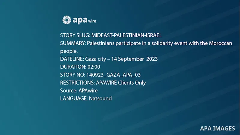 Palestinians participate in a solidarity event with the Moroccan people, in Gaza city .