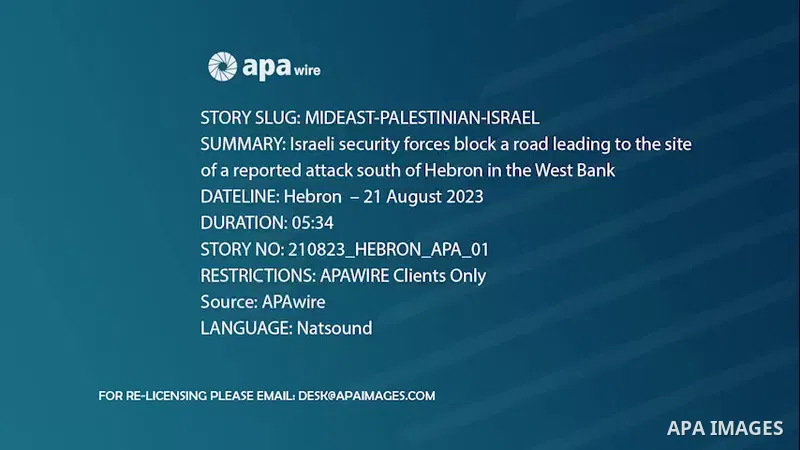 Israeli security forces block a road leading to the site of a reported attack south of Hebron in the West Bank.