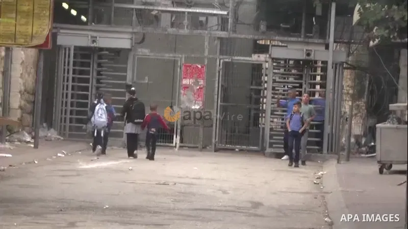 Palestinian students make their way to school in the West Bank city of Hebron