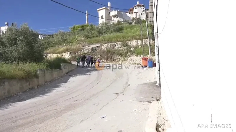Palestinian students return to school after teachers suspend their strike, in the West Bank city of Jenin. 0.1